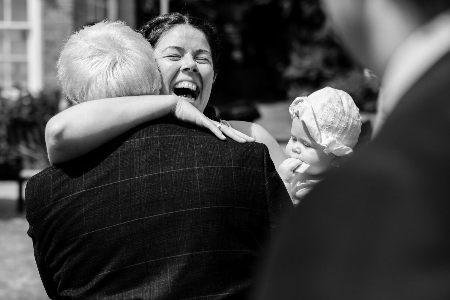 Black and white candid shots of wedding reception moments and celebrations.