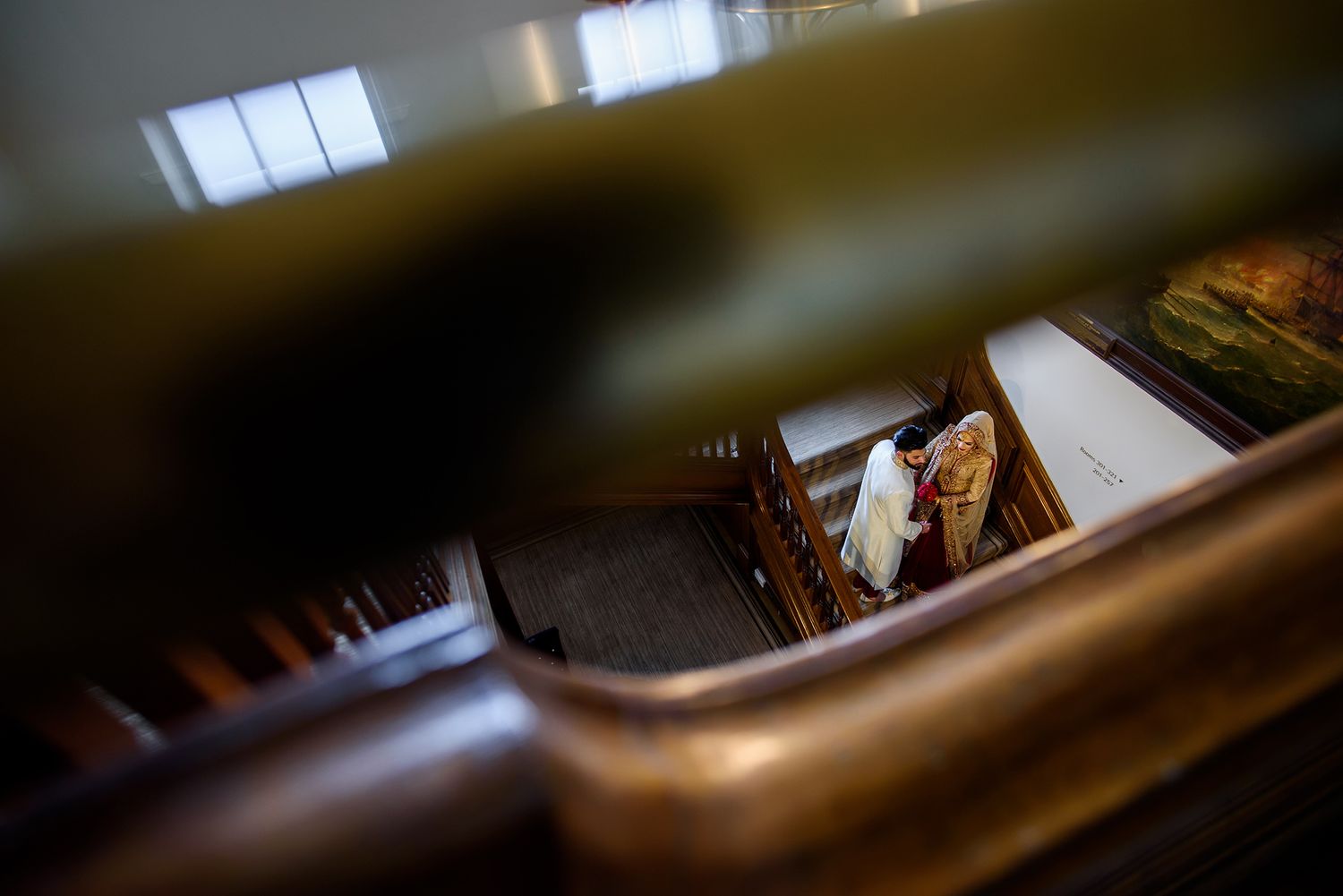 An artistic shot through stair railings showing movement and light.