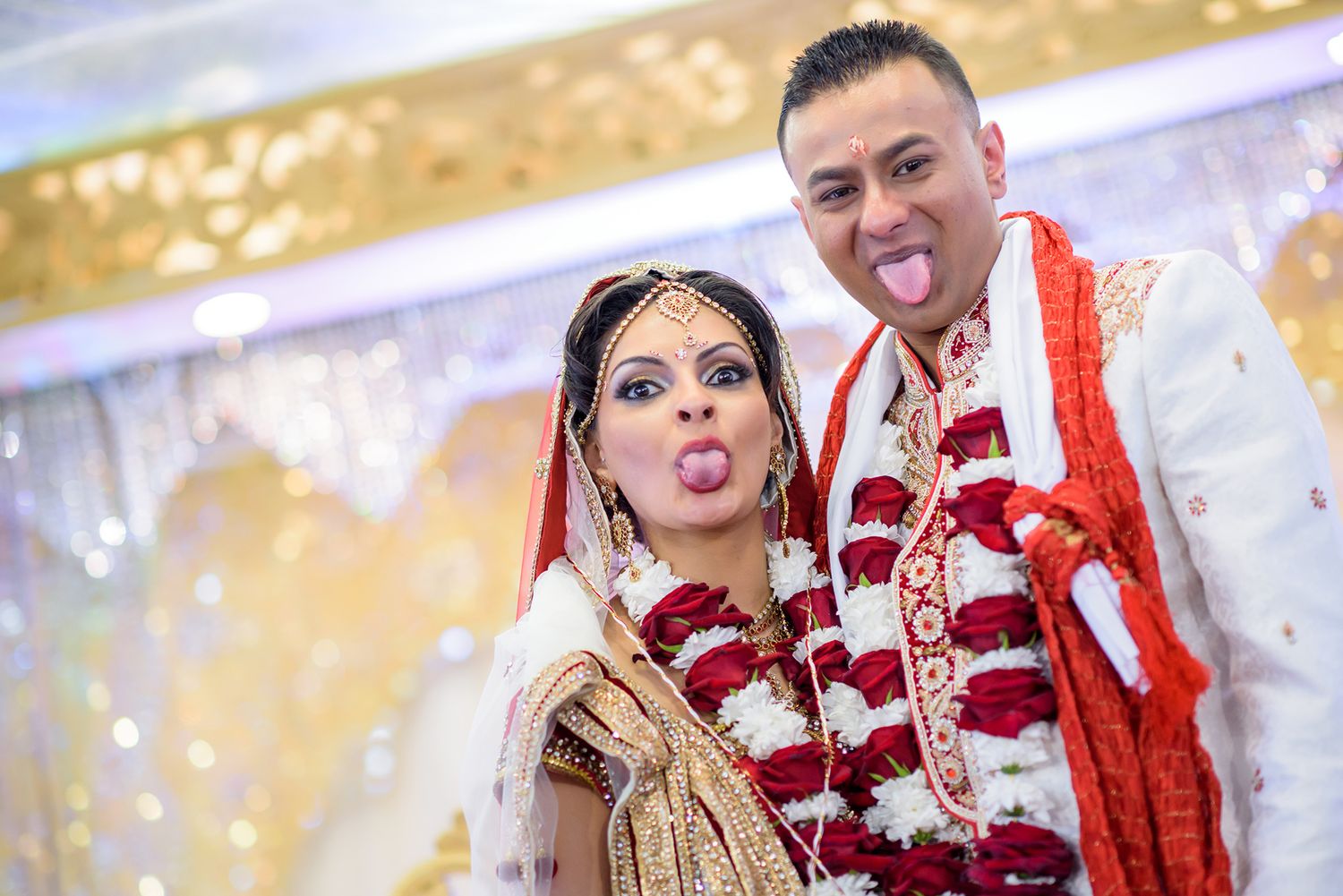 Wedding attendees enjoying celebrations with traditional Indian decorations and attire.