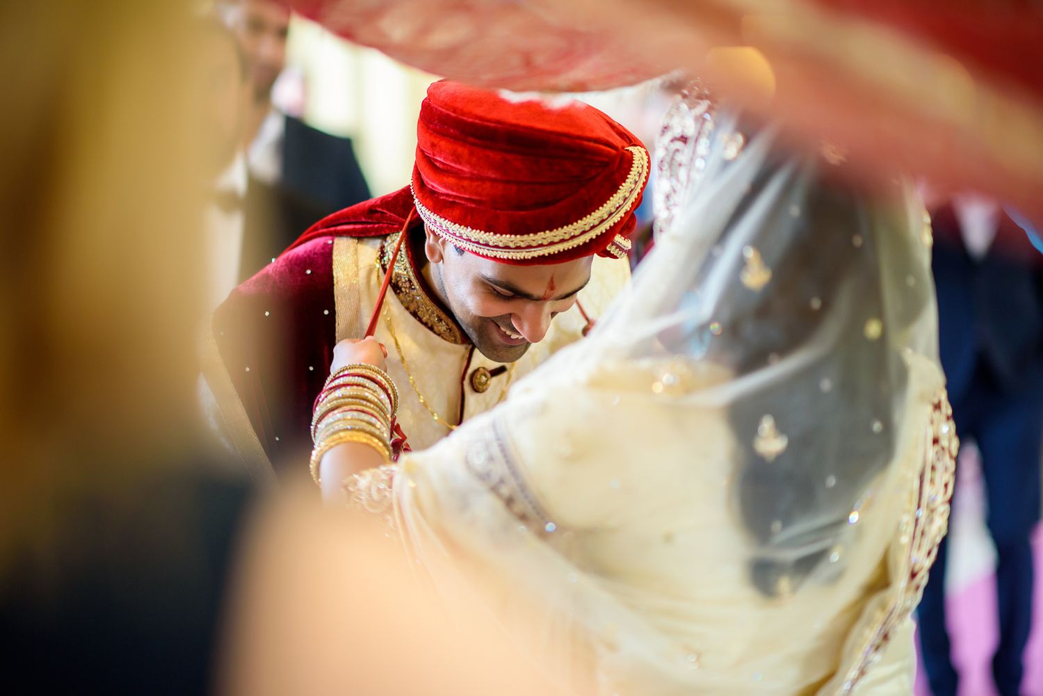 Close-up shots of traditional Indian wedding attire and jewelry details.
