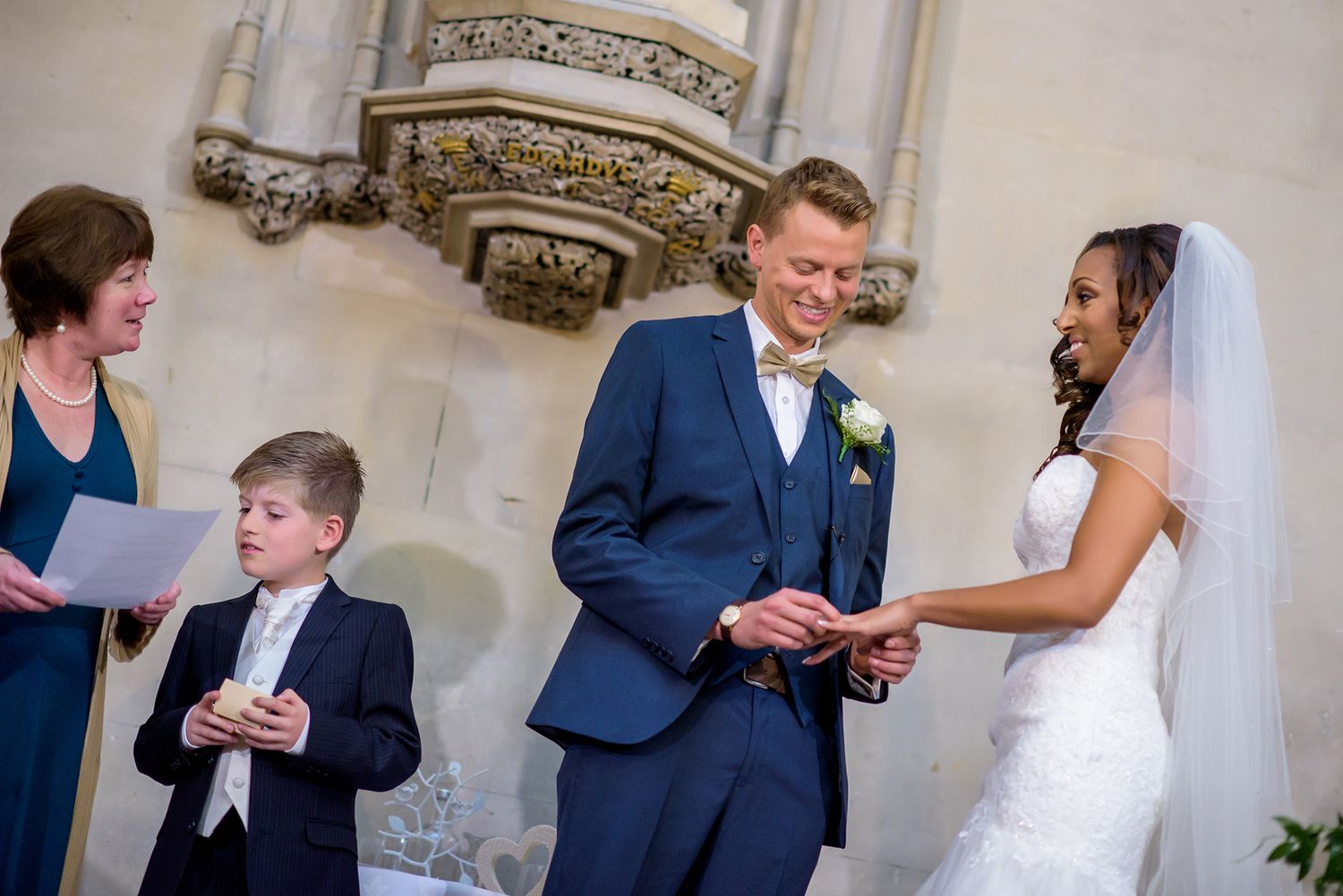 Wedding ceremony taking place on ornate white marble staircase.