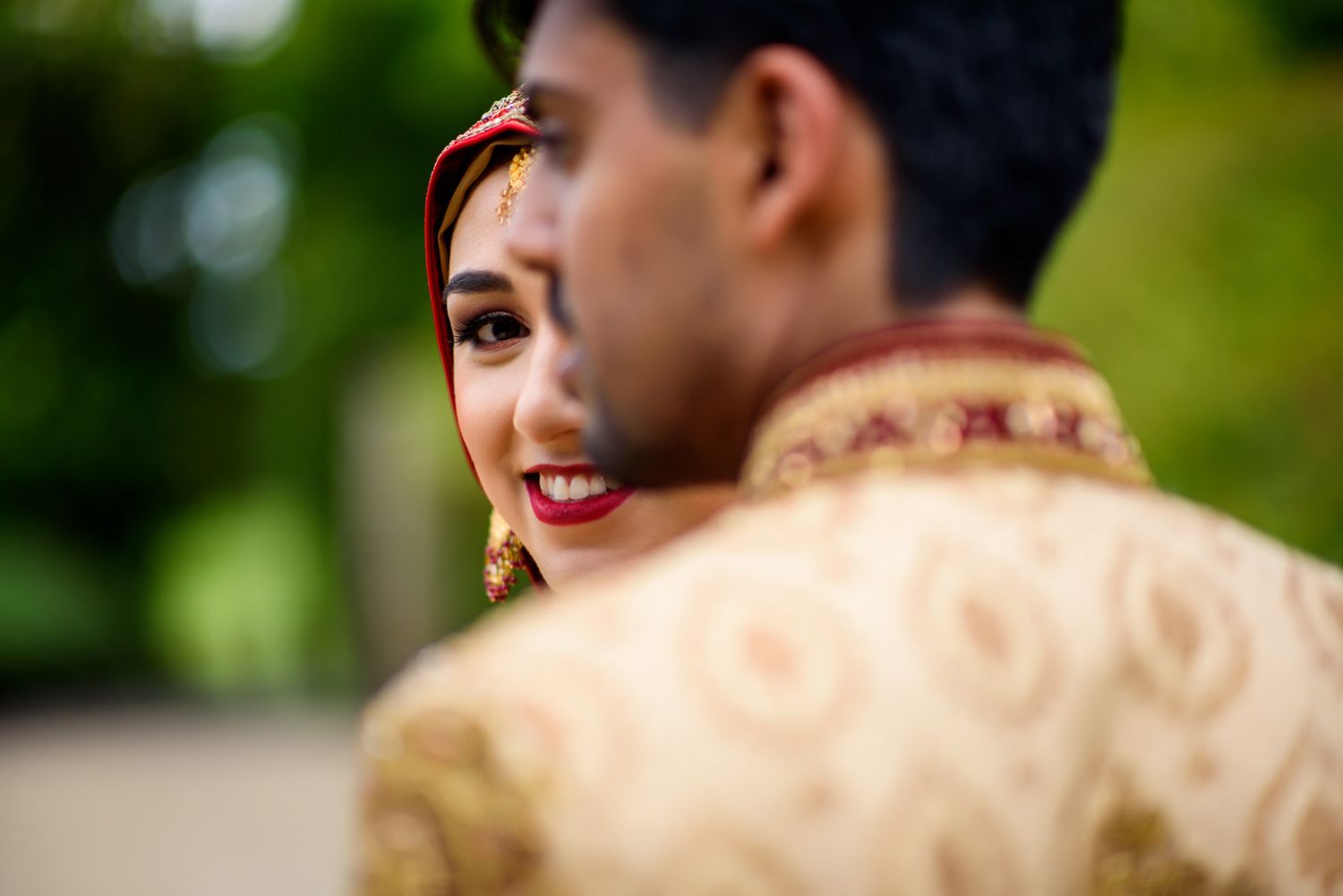Candid moments captured during a traditional South Asian wedding ceremony outdoors.