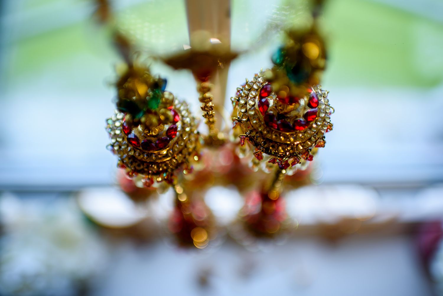 Close-up macro photography of golden glittery decorative items creating an abstract pattern.