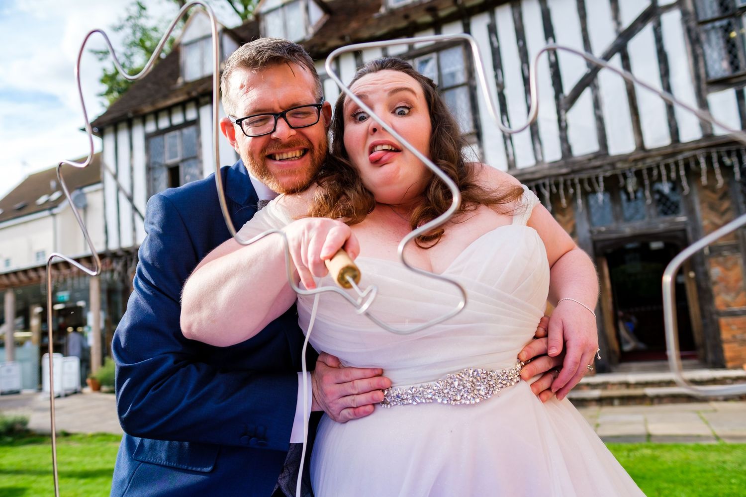 Candid moments of laughter and joy between couples at a rustic venue.