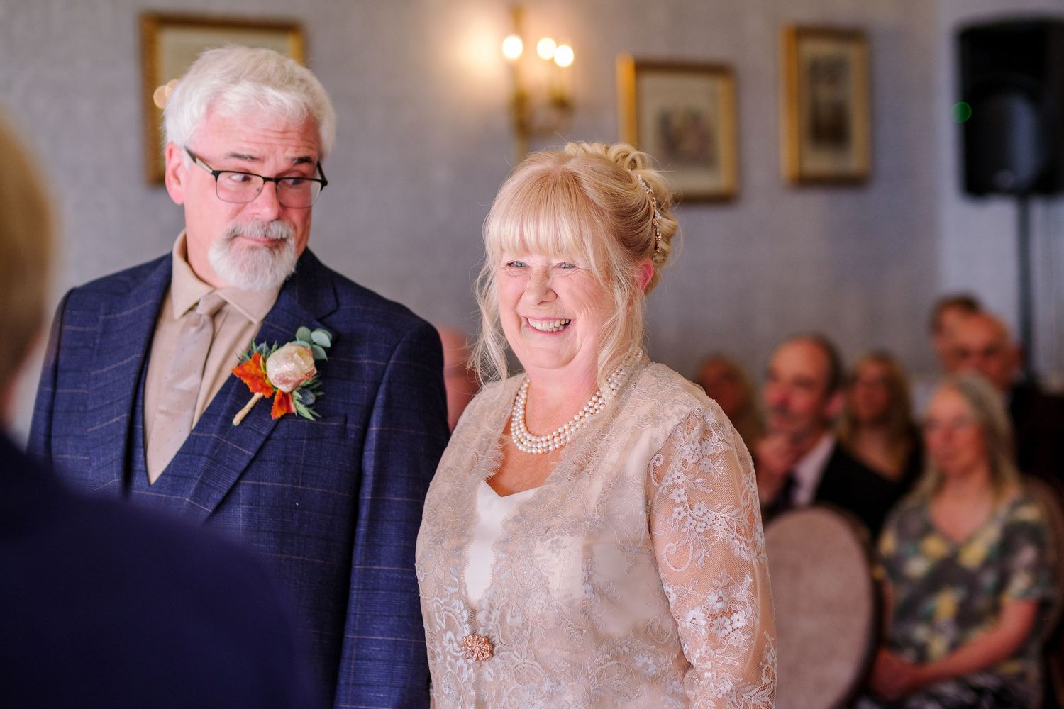 Joyful celebration scenes at an elegant indoor wedding reception with formal attire.