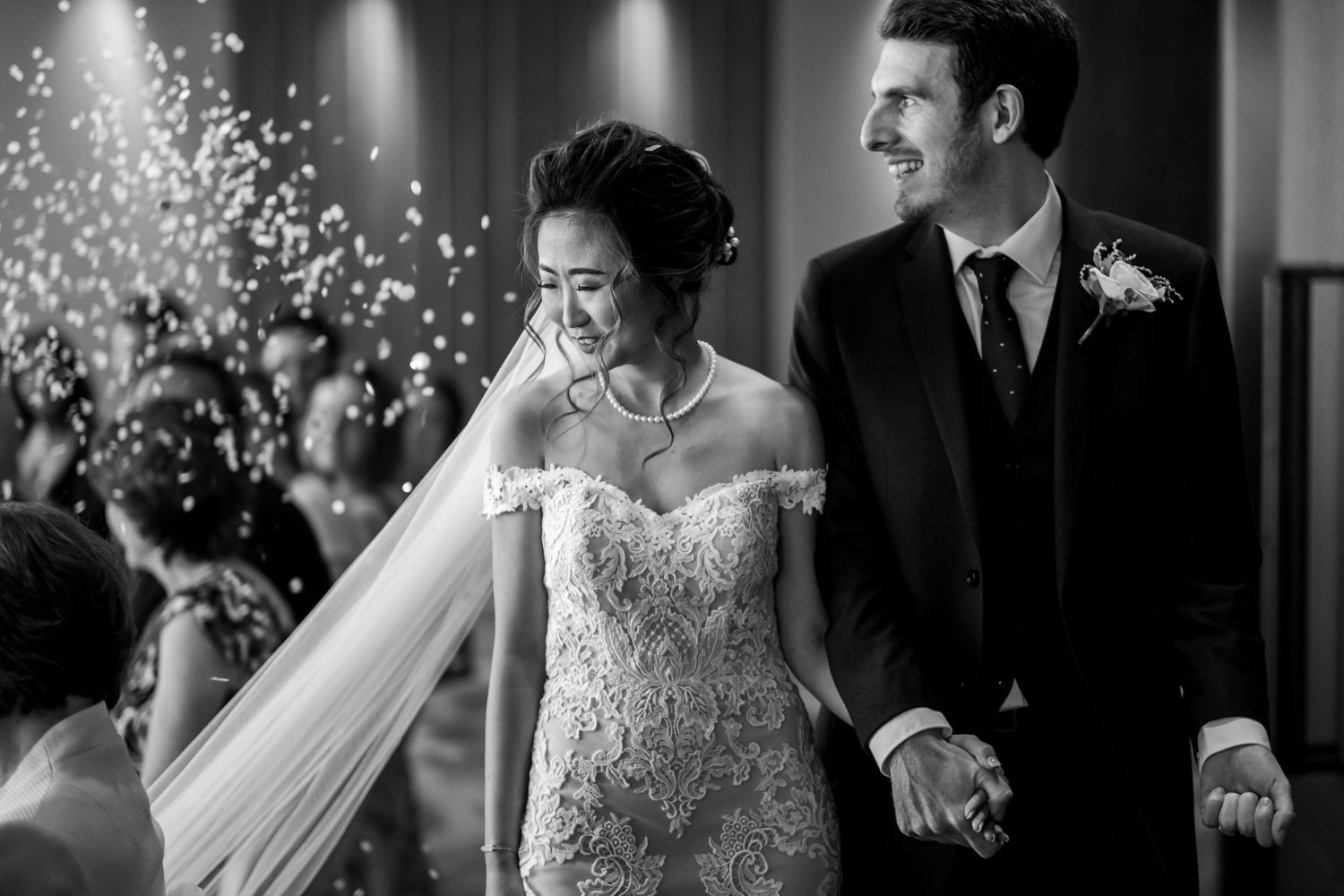 A series of joyful wedding celebration moments captured in black and white photography.