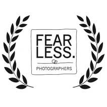 Row of black and white laurel wreath photography award emblems.