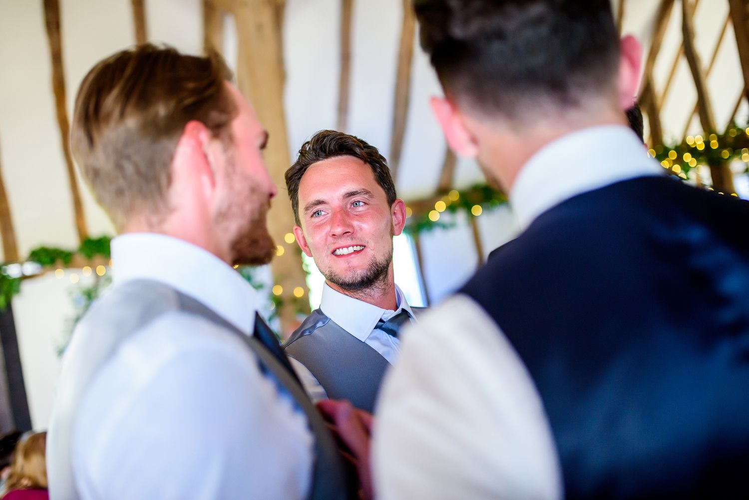 Guests mingle and socialize at an elegant outdoor wedding celebration.