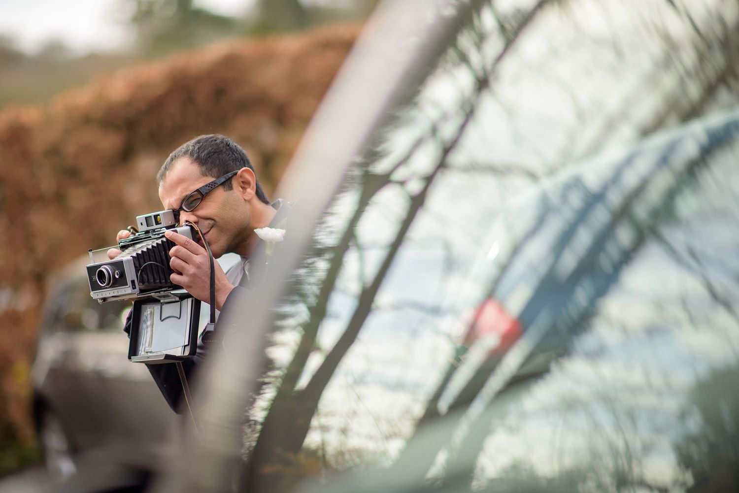 Series of candid shots showing photographers at work during an outdoor event.