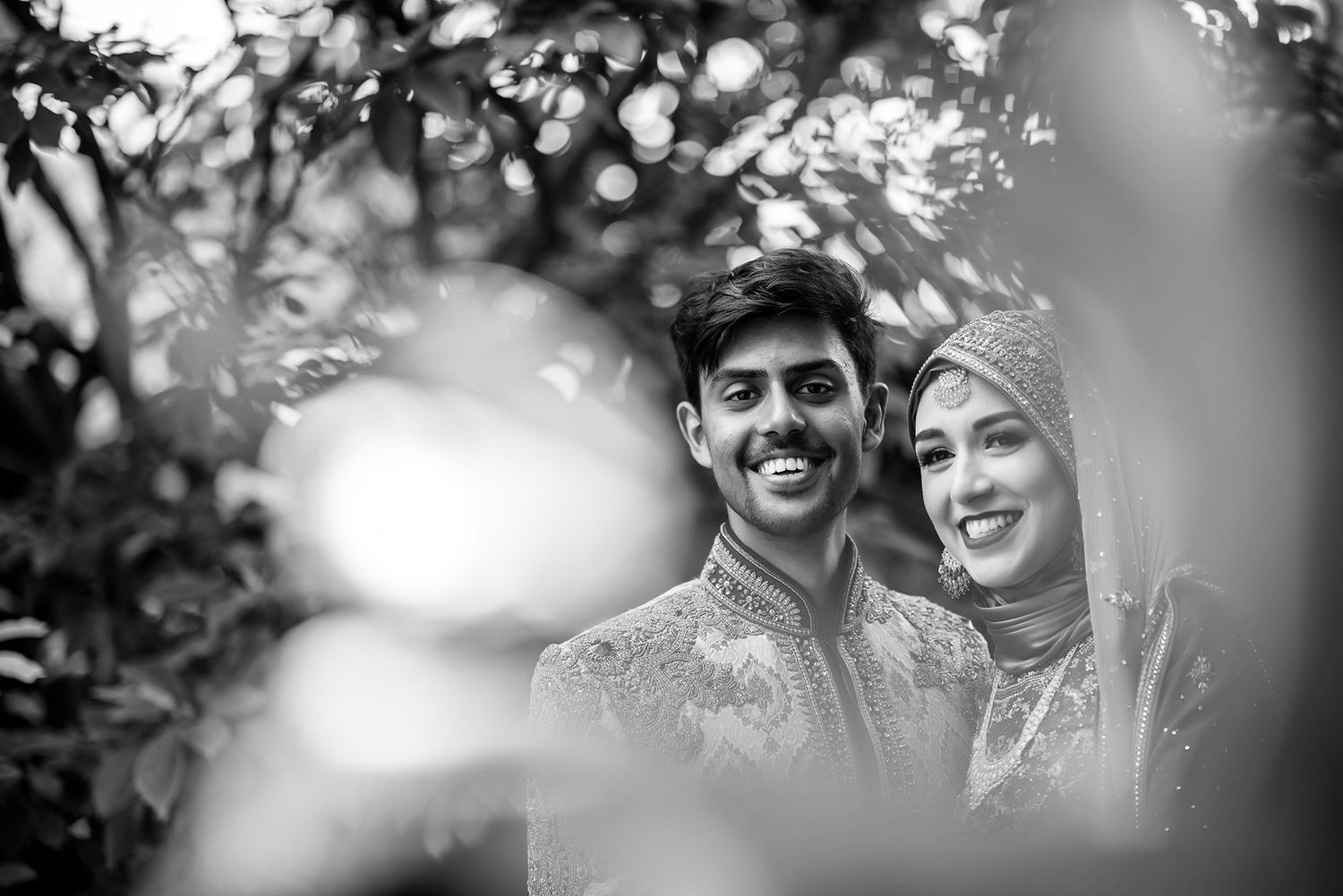 Artistic black and white portrait sequence showing candid emotional moments through natural framing.