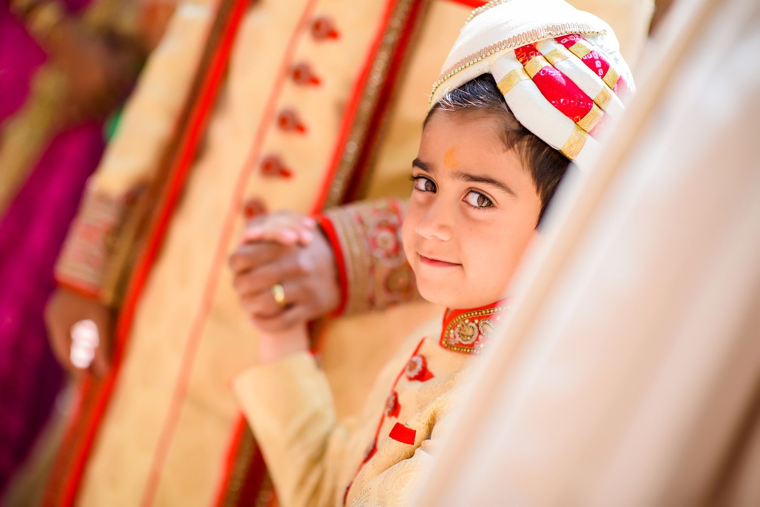 Traditional decorative Indian wedding attire captured in close-up portrait.