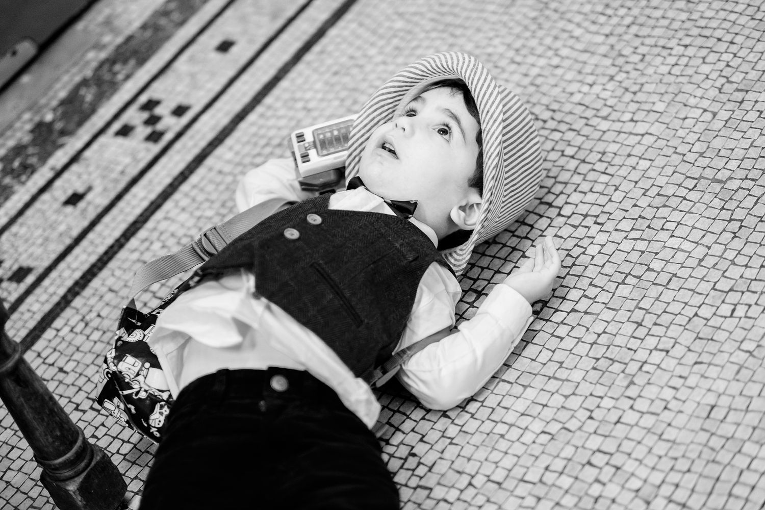 Black and white photo series showing candid wedding reception moments in an elegant venue.