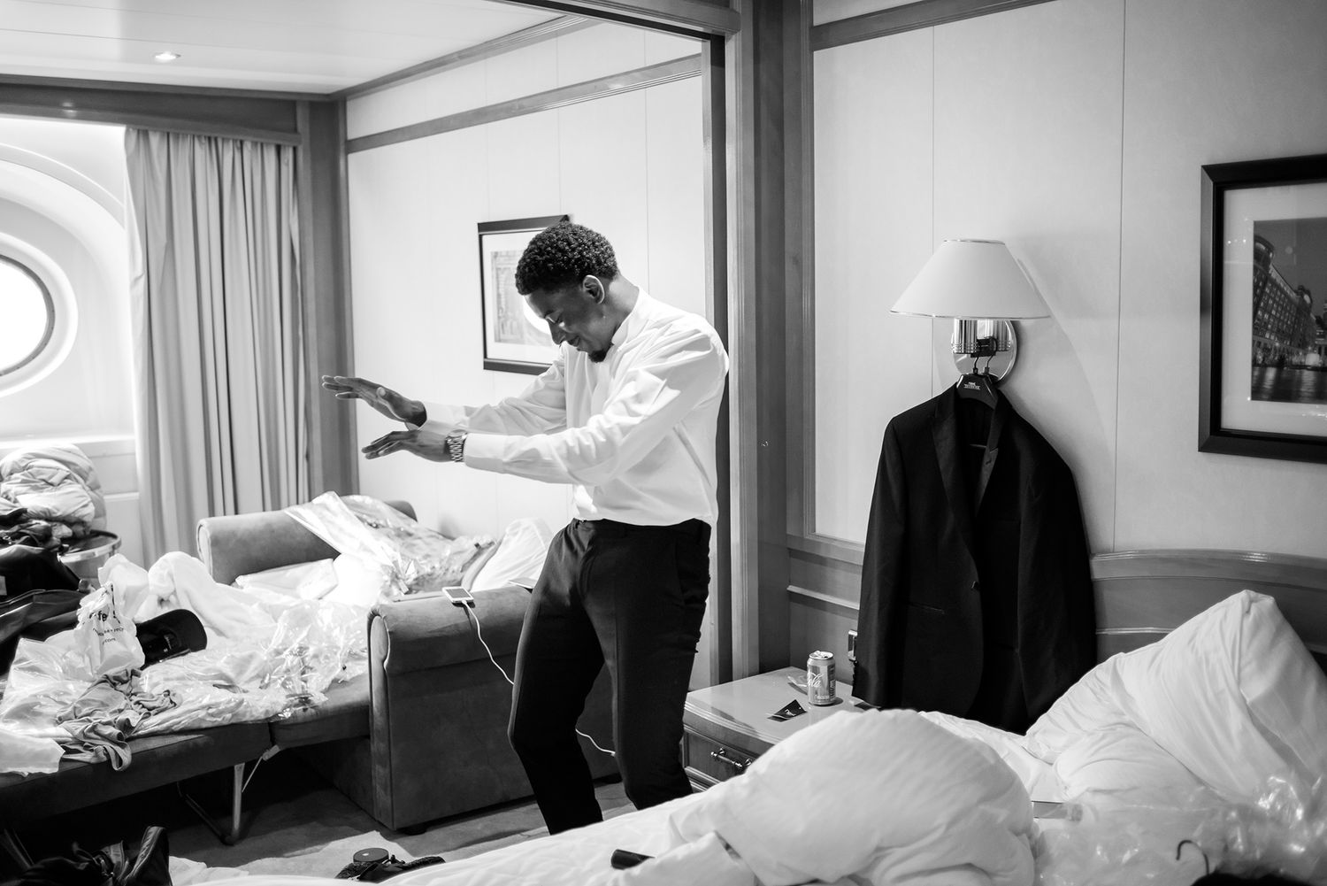 Black and white series of photos showing preparation moments in a hospital room.