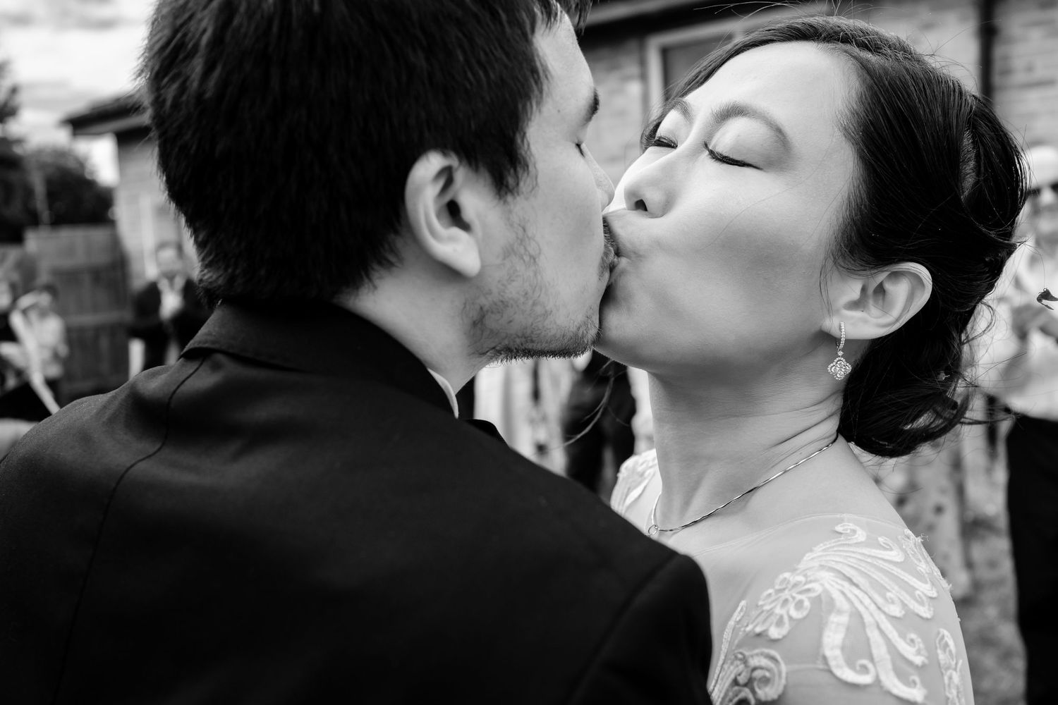A collection of black and white photographs showing intimate moments between two people kissing.