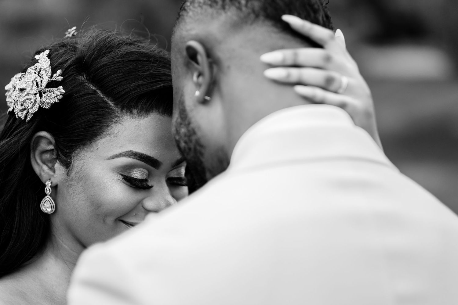 Black and white close-up shots capturing tender wedding moments.