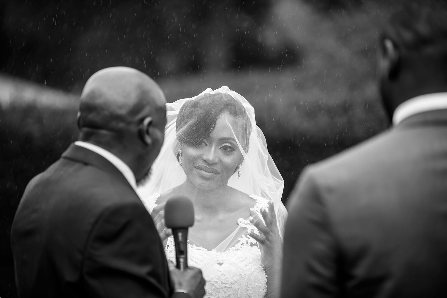 Black and white wedding ceremony photography showing intimate moments between the couple.