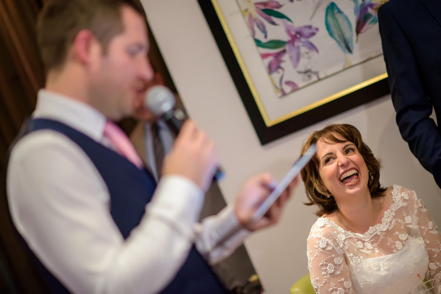 Joyful moments captured during a wedding reception with guests interacting and celebrating.