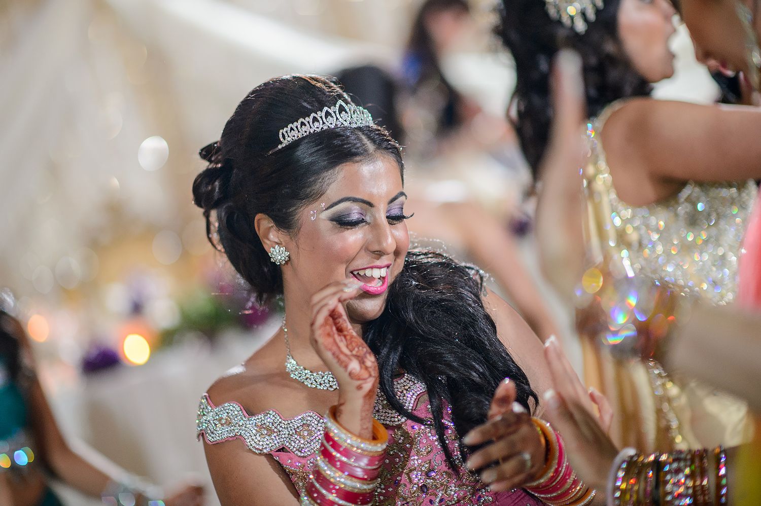 Traditional Indian wedding celebration with ornate jewelry and decorative details.