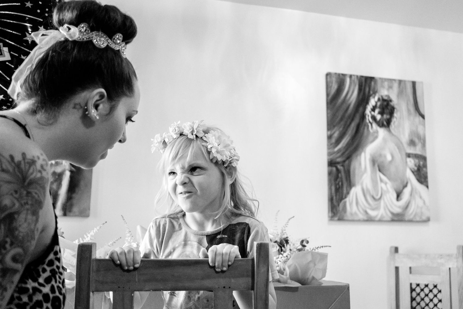 A collection of black and white photographs showing emotional wedding moments arranged in a horizontal grid layout.