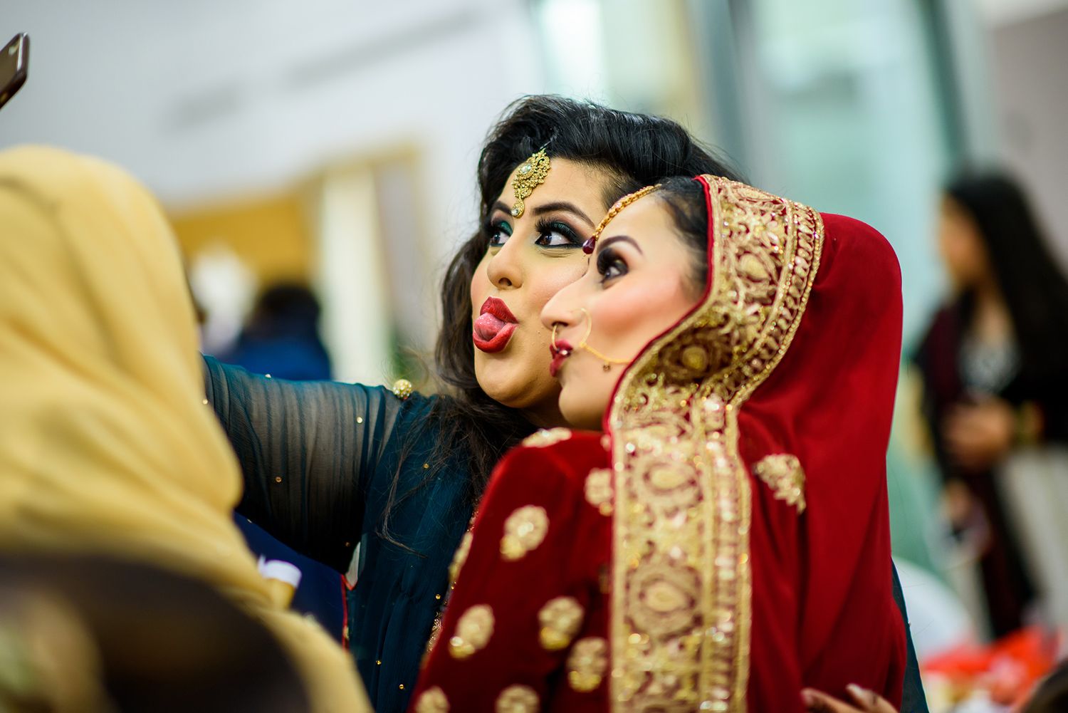 Traditional wedding attire featuring red and gold embroidered details.