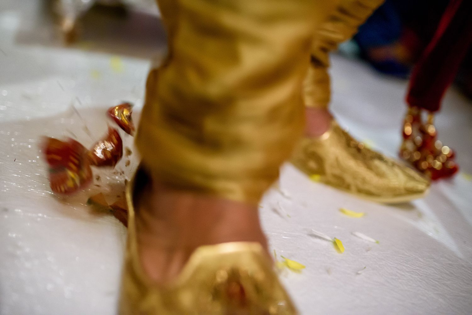 Close-up of golden traditional Indian wedding clothing details.