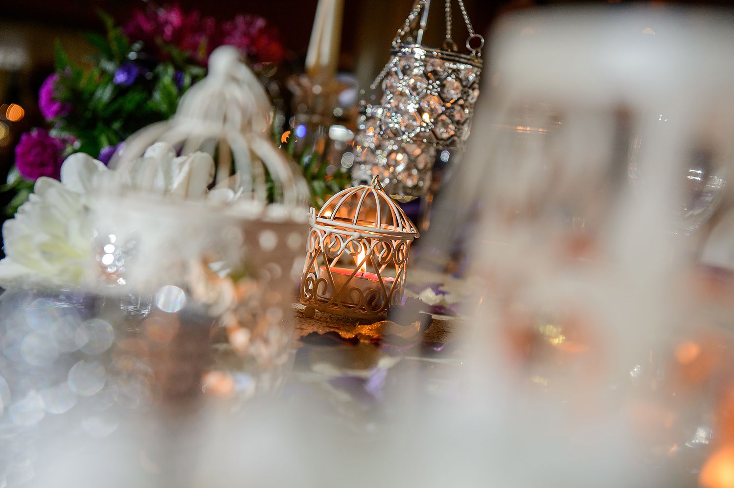 Crystal centerpieces and decorative elements glowing under ambient lighting.