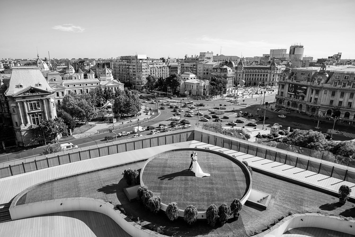 Panoramic cityscape view from a rooftop wedding venue showing urban buildings and architecture.