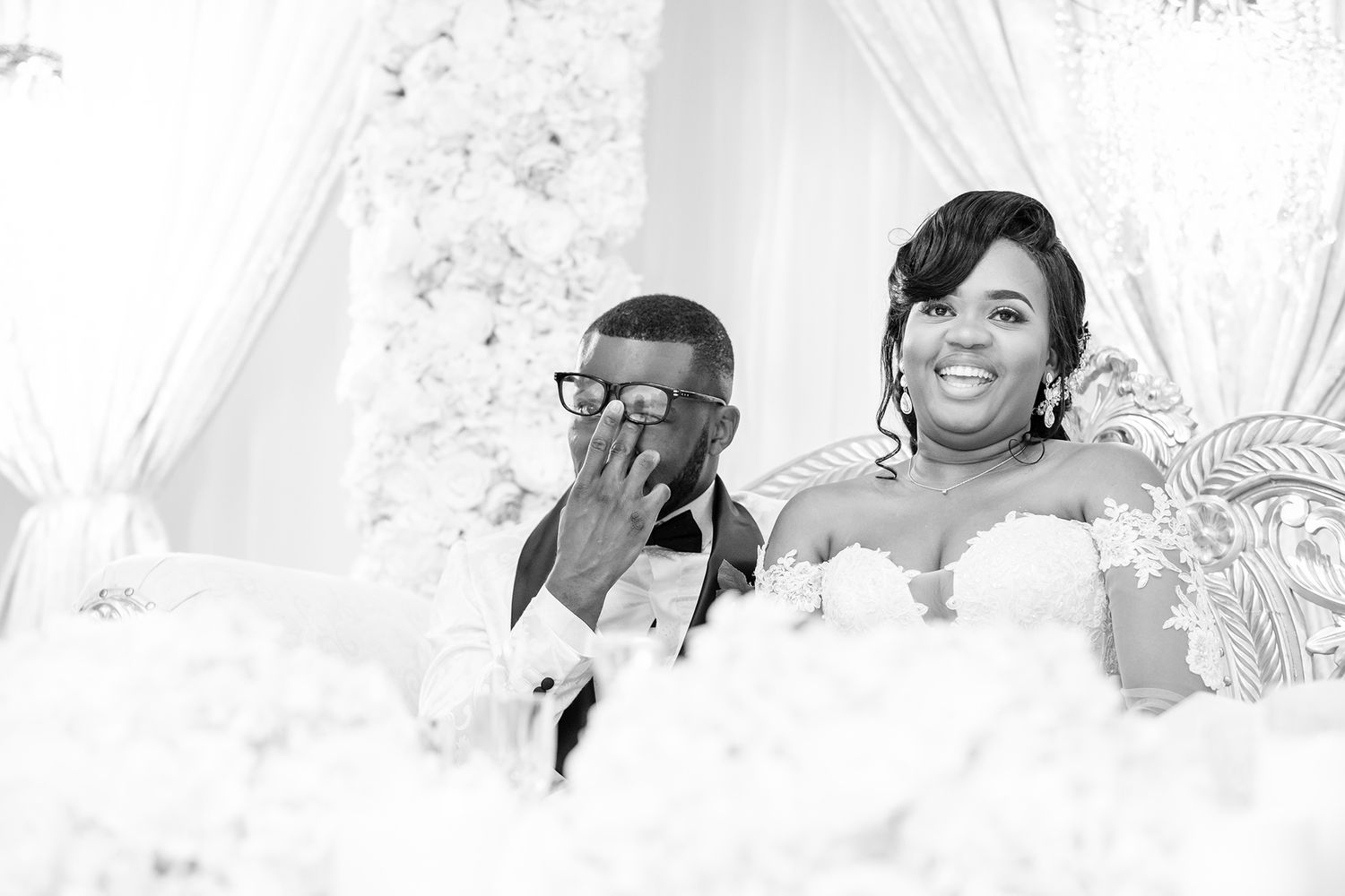 Candid black and white shots of wedding reception celebrations and toasts.
