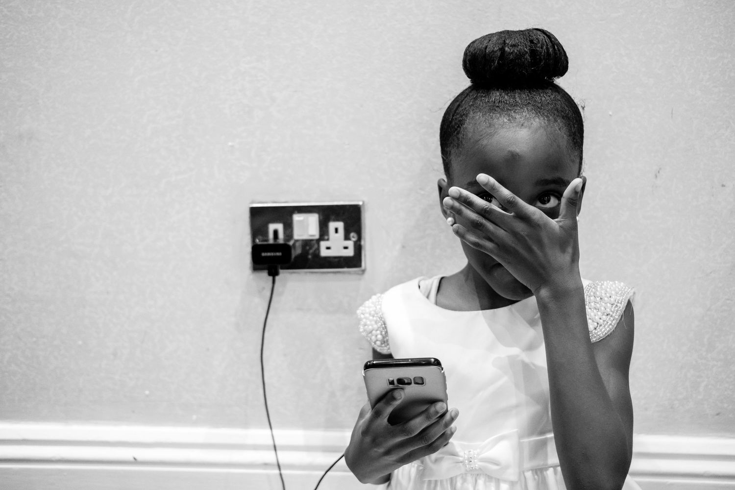 A series of candid emotional moments captured in black and white during a wedding.