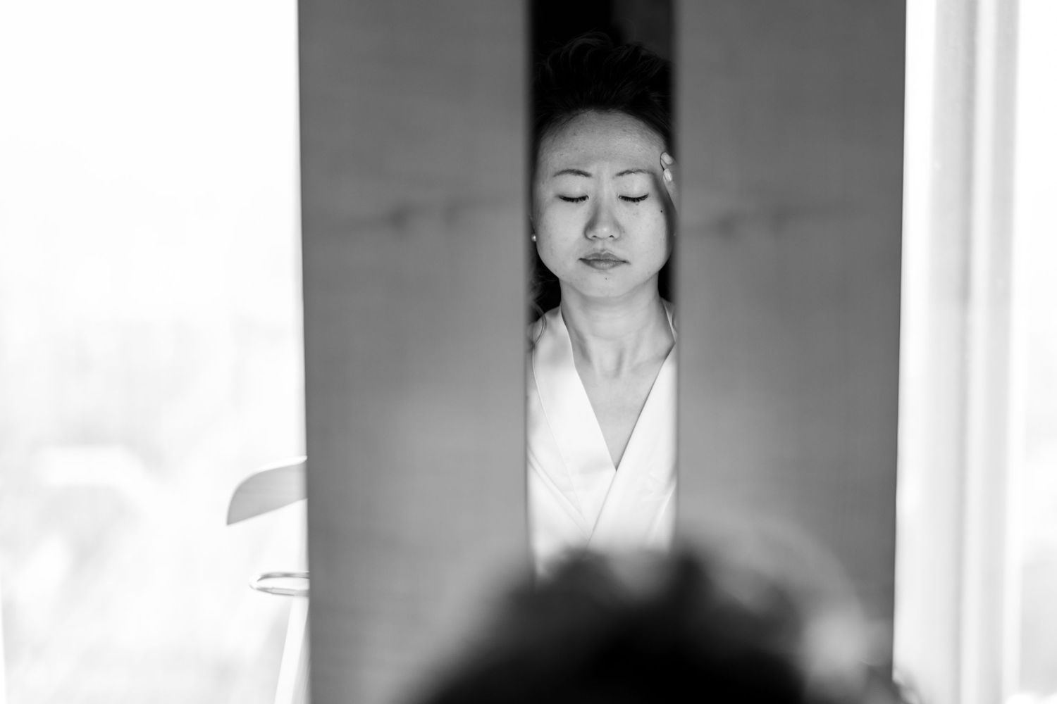 A black and white photo series showing someone in traditional Japanese clothing against a white background.