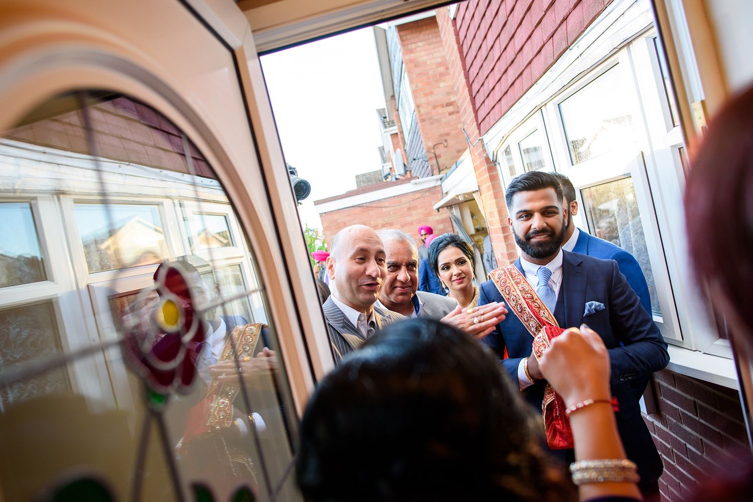 Indoor gathering with guests in formal attire at a celebratory event.