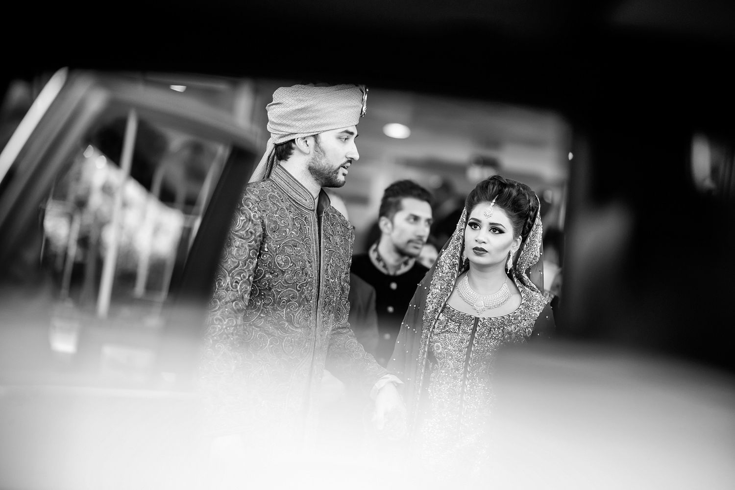 Artistic black and white wedding photography capturing candid moments during celebrations.