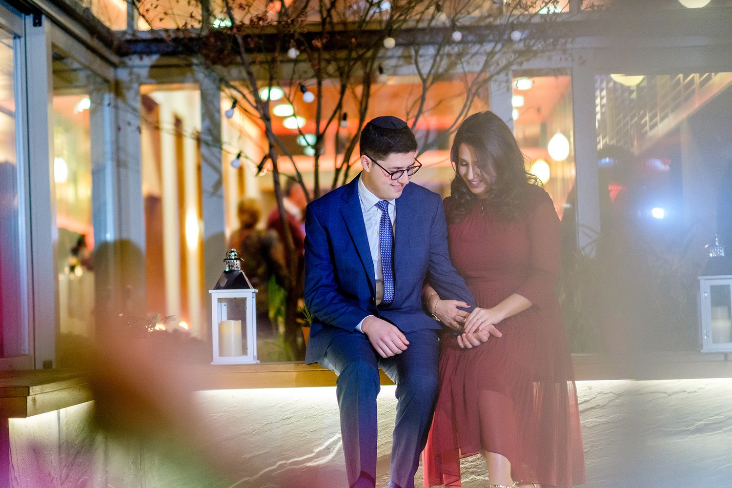 Evening outdoor celebration with warm lighting and festive atmosphere.