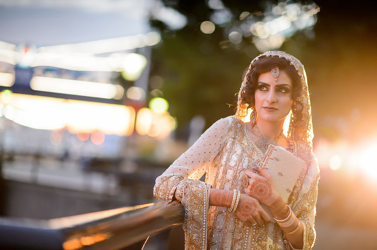 Romantic sunset photoshoot at Tower Bridge with warm golden lighting.