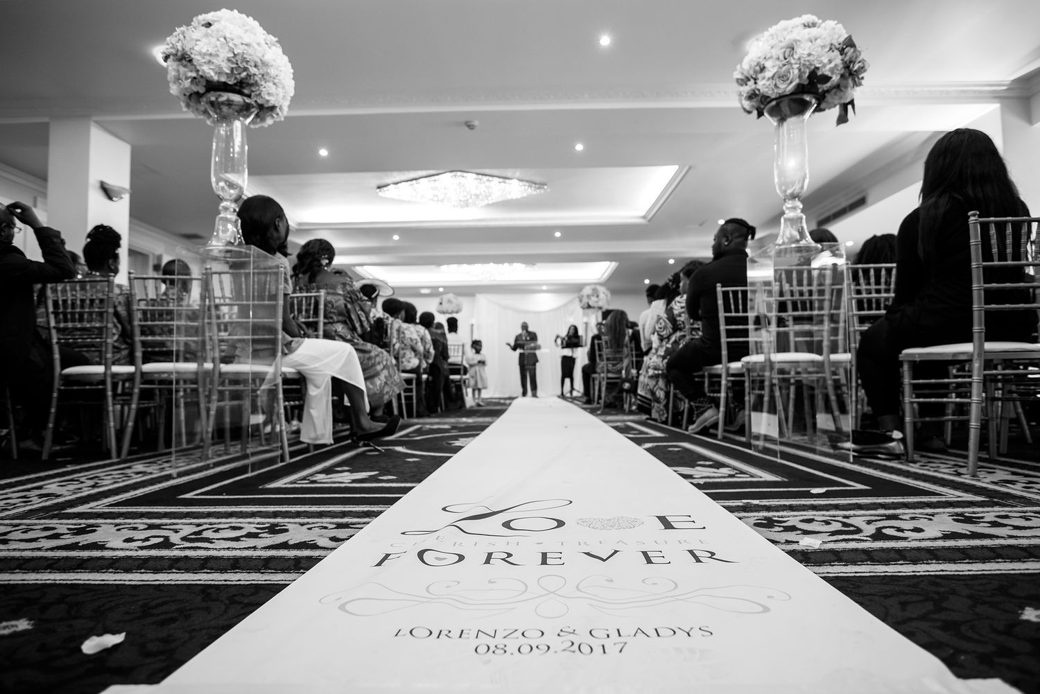 Black and white wedding reception setup with formal chiavari chairs.