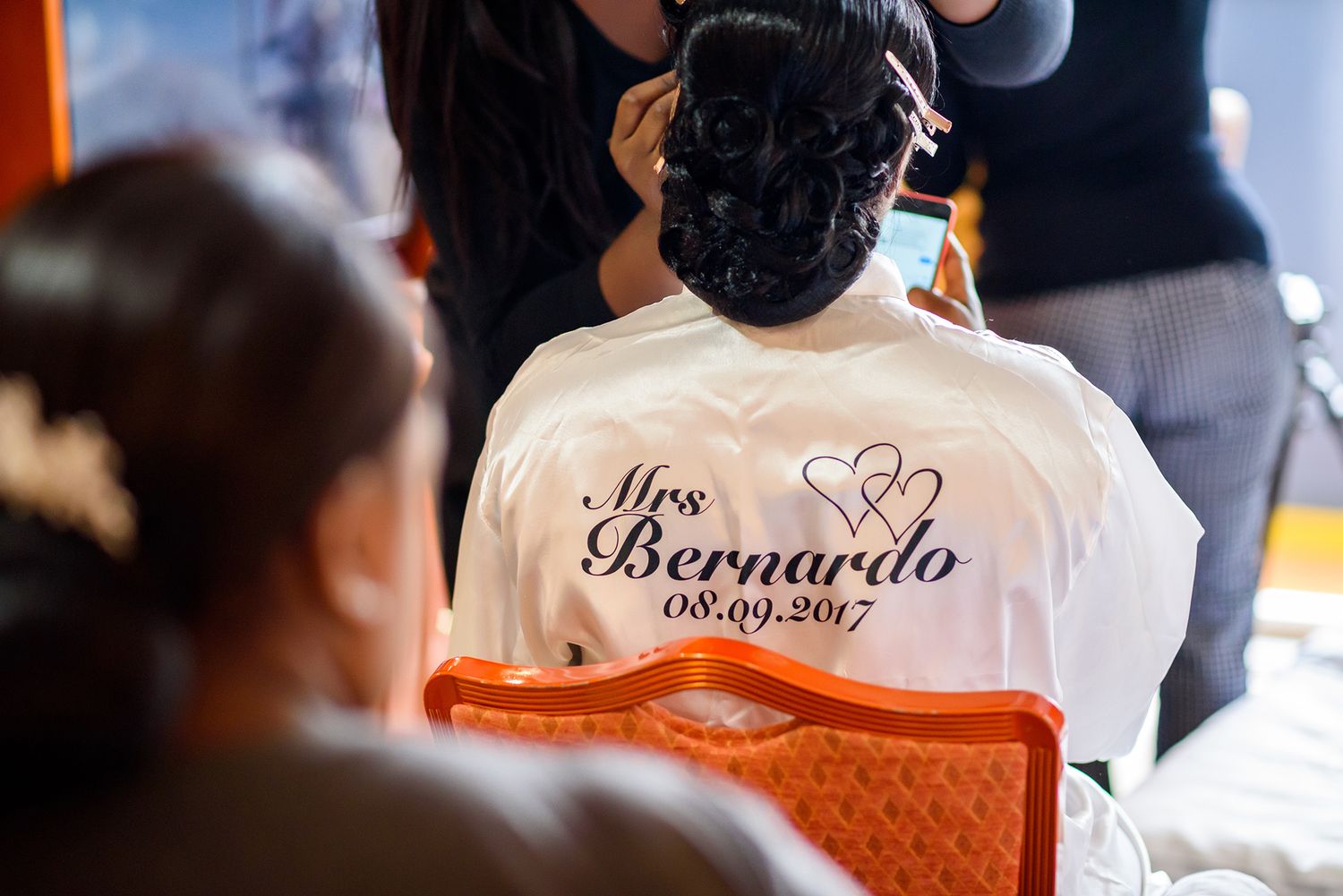 Multiple bottles of Bernardino liquor displayed on a counter.