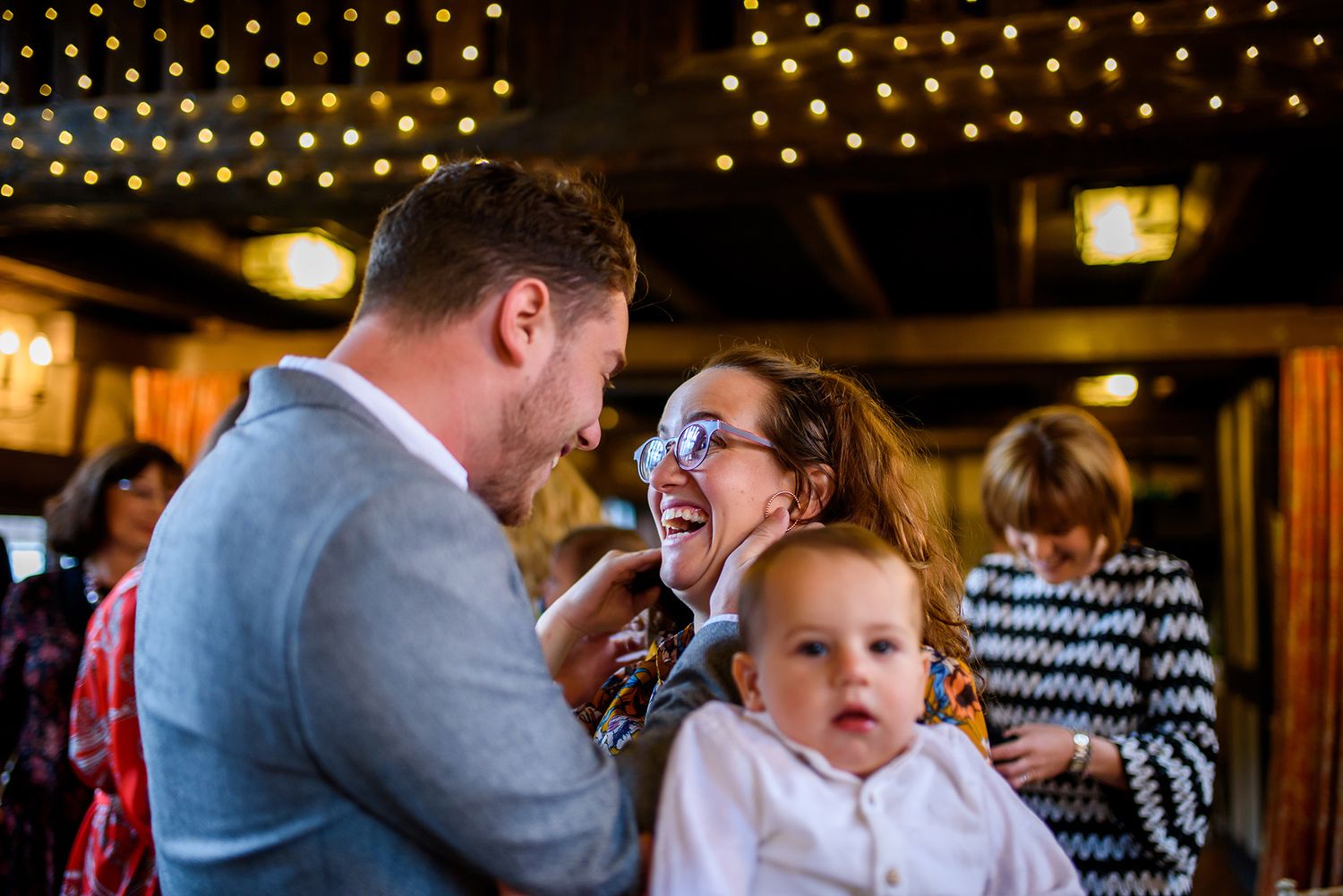 Reception venue decorated with twinkling string lights creating an intimate atmosphere.