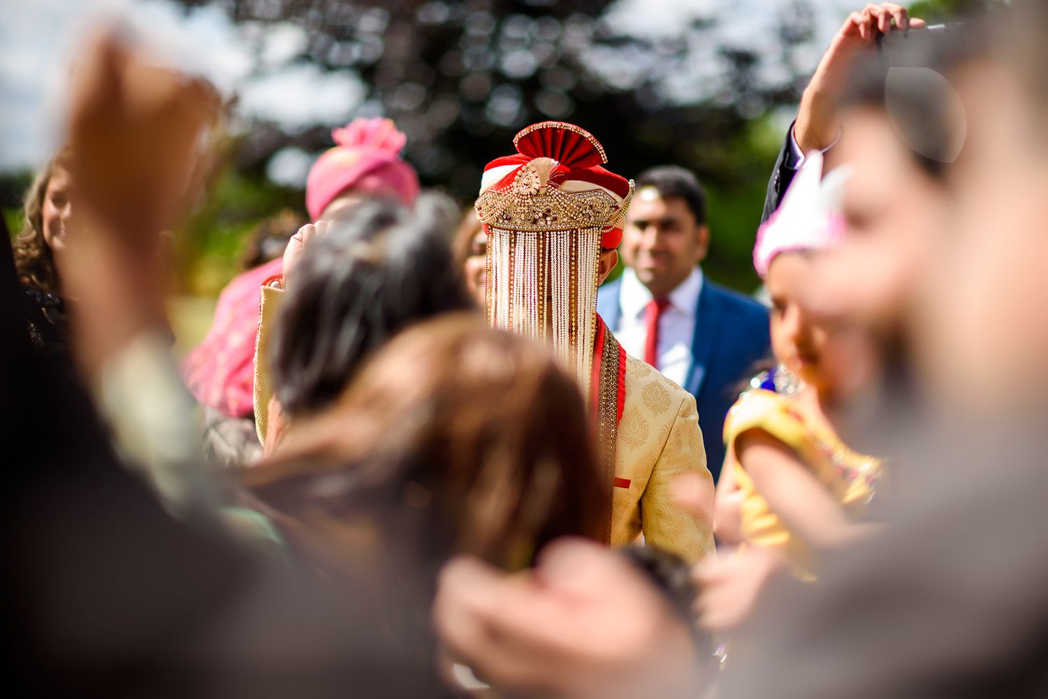 Festive outdoor celebration with bright decorations and dancing.