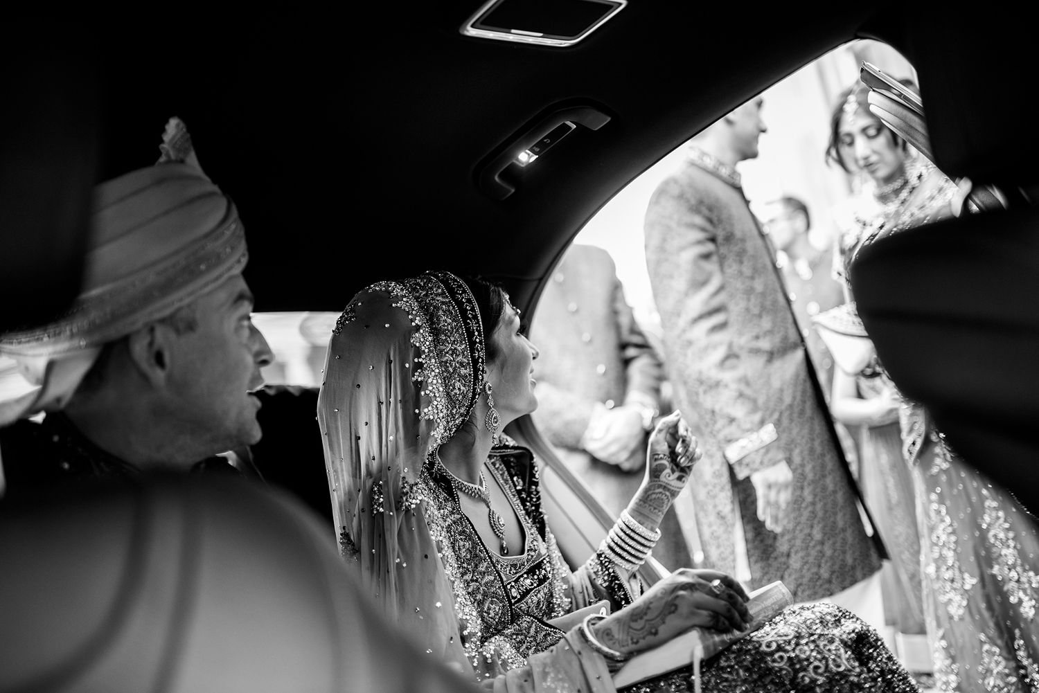 Dramatic black and white wedding photography with creative composition and lighting.