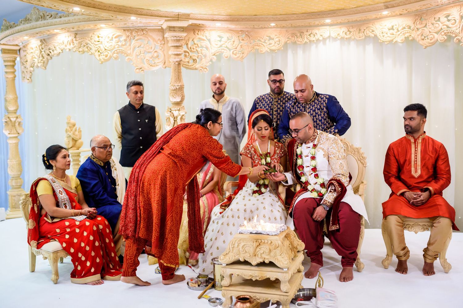 Panoramic view of a luxurious Indian wedding venue with ornate decorations and seating arrangements.