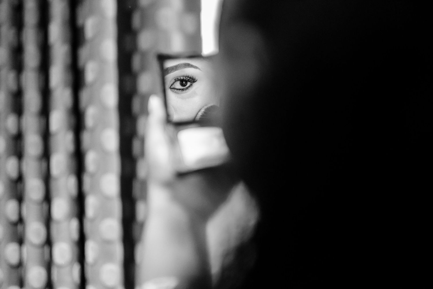 Artistic black and white photograph showing dramatic lighting and shadows.