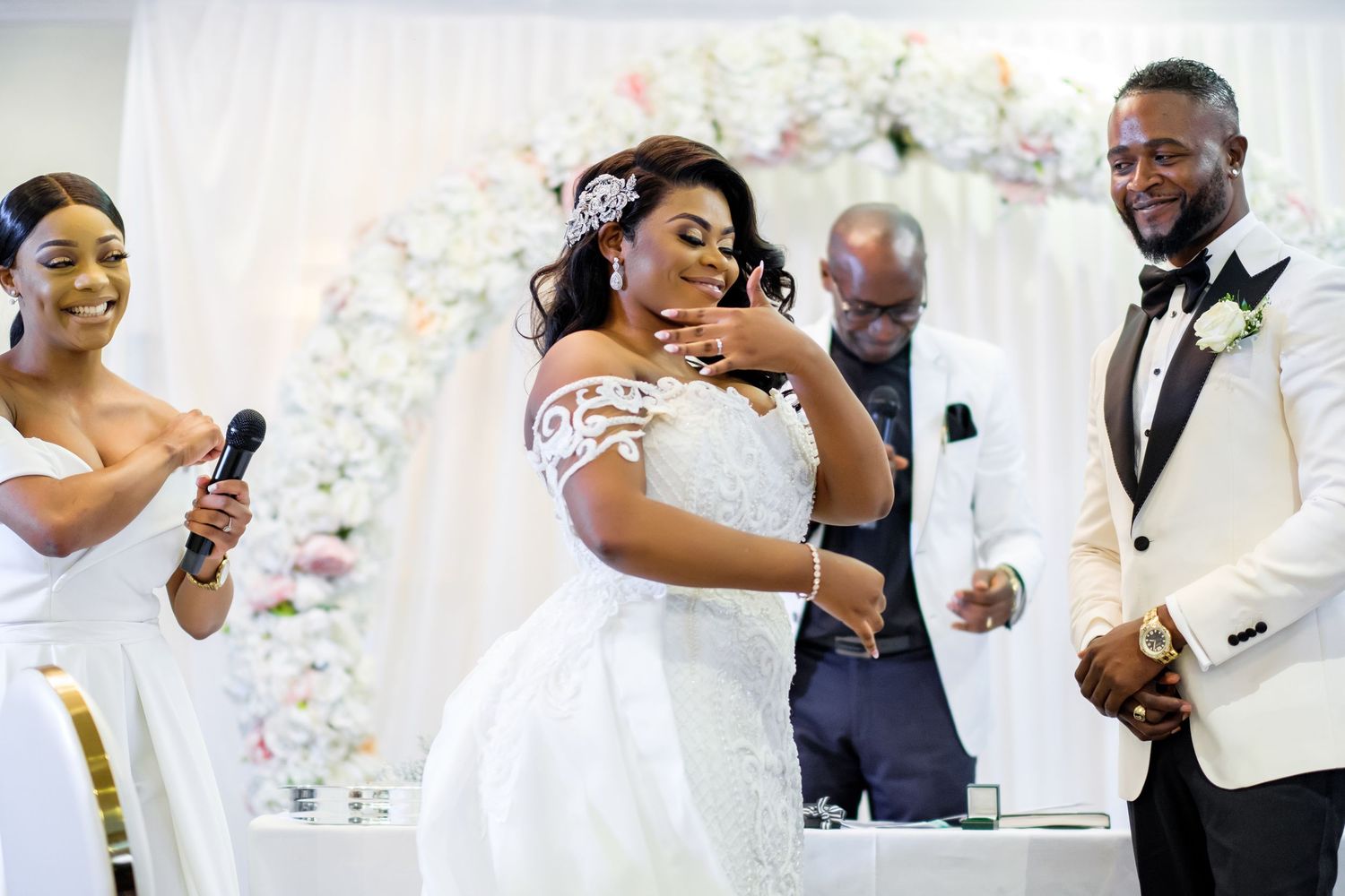 Wedding party members interact and celebrate during reception festivities.