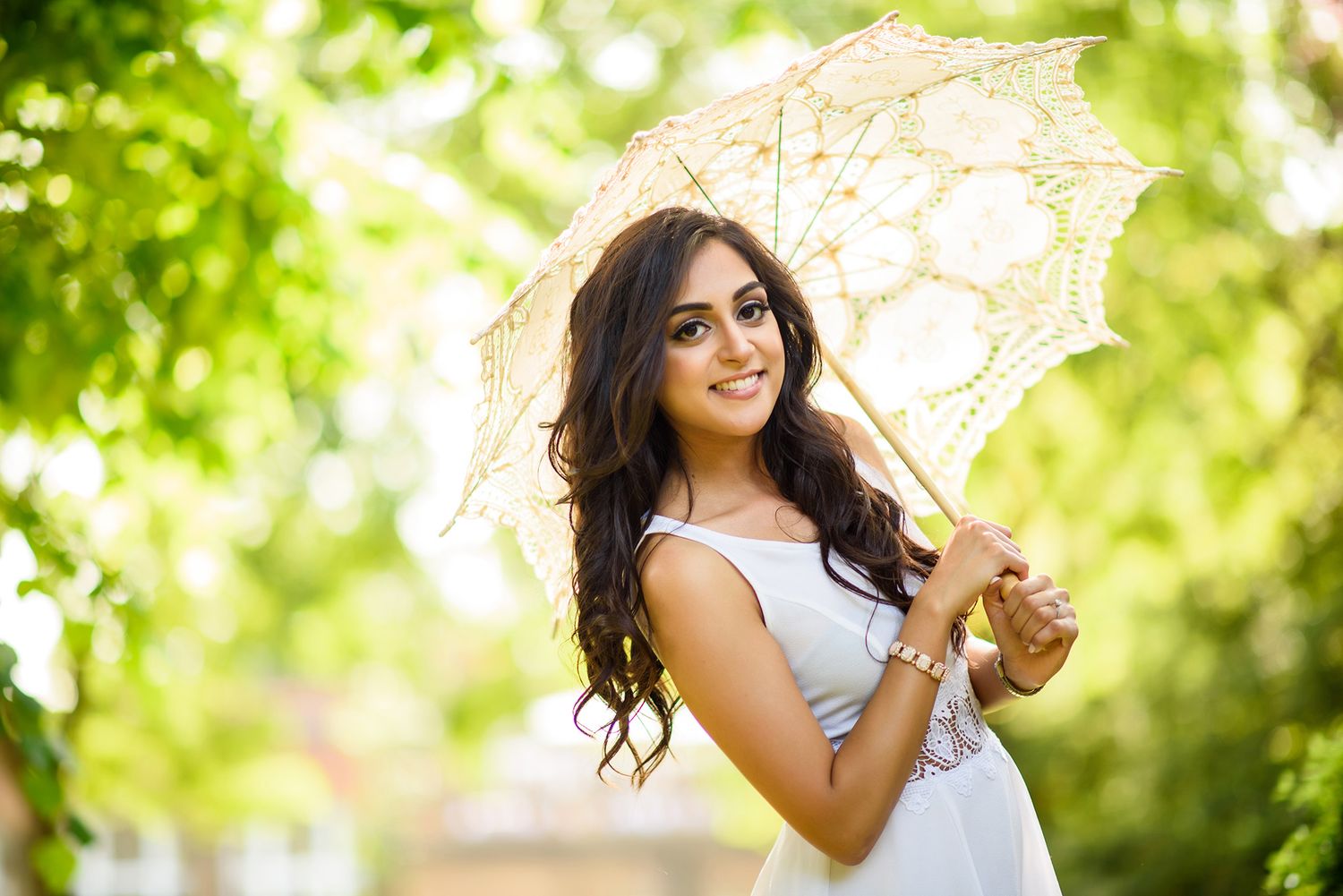 Romantic garden portraits with vintage lace parasol and natural lighting.