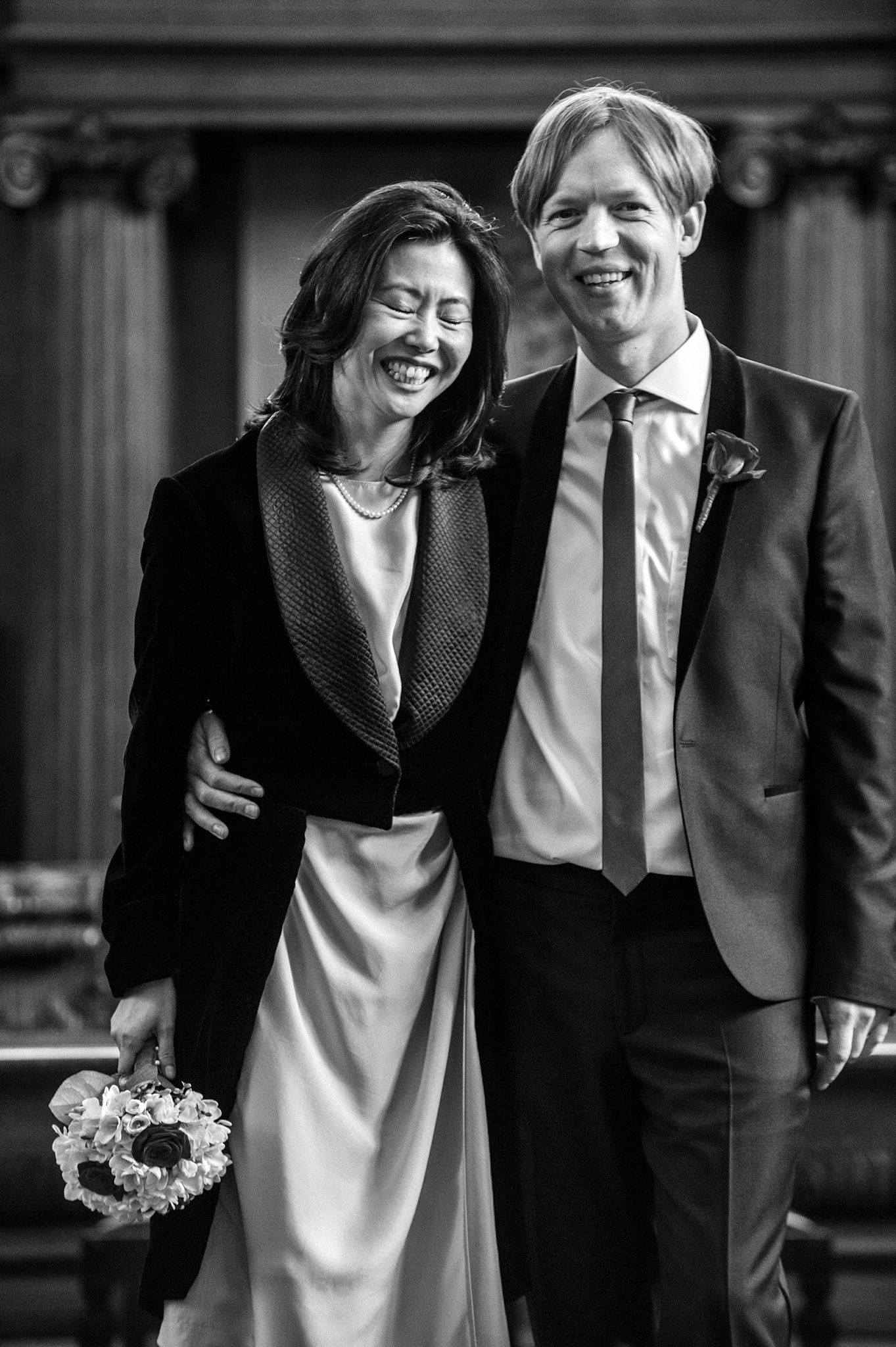 Black and white candid photos showing joyful moments at a wedding celebration.