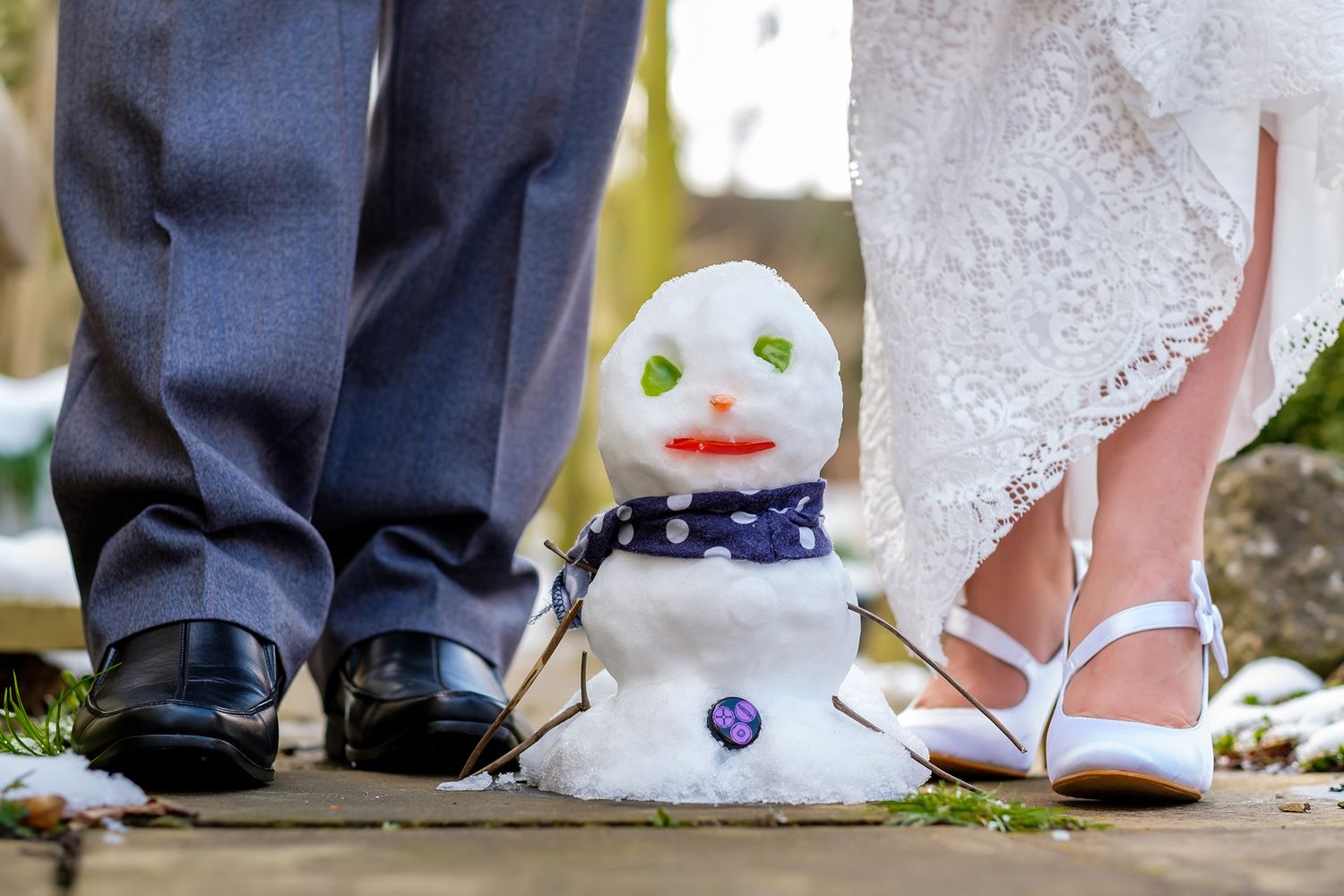 Various wedding shoes and dress details shown in creative close-up shots on outdoor ground.