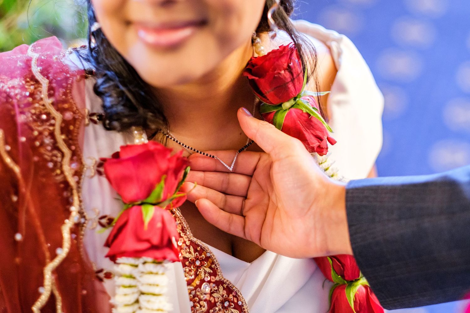 Wedding celebration collage showing traditional Indian bridal jewelry and decorative elements against blue sky background.