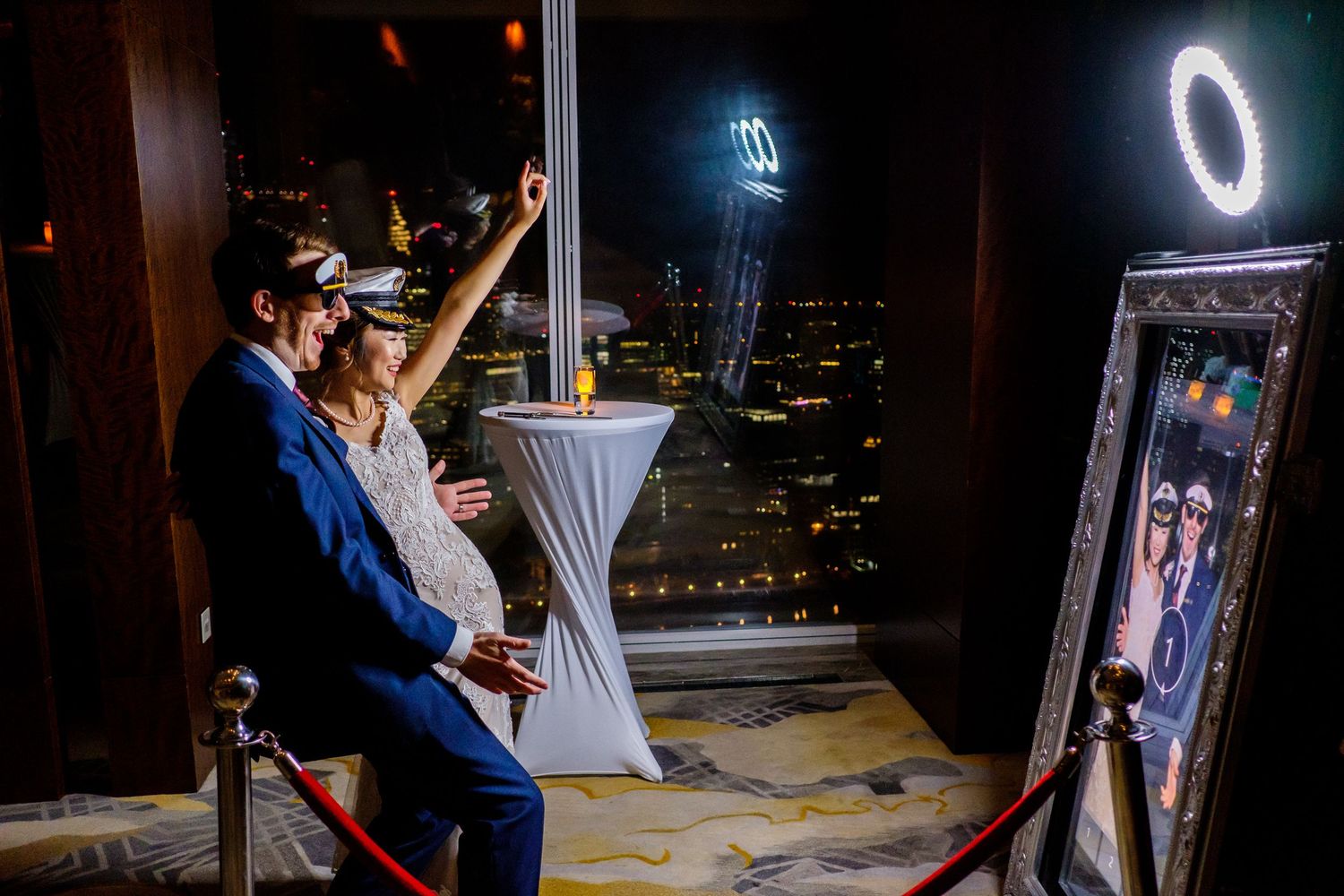 Artistic nighttime wedding photography with illuminated ring light effects.