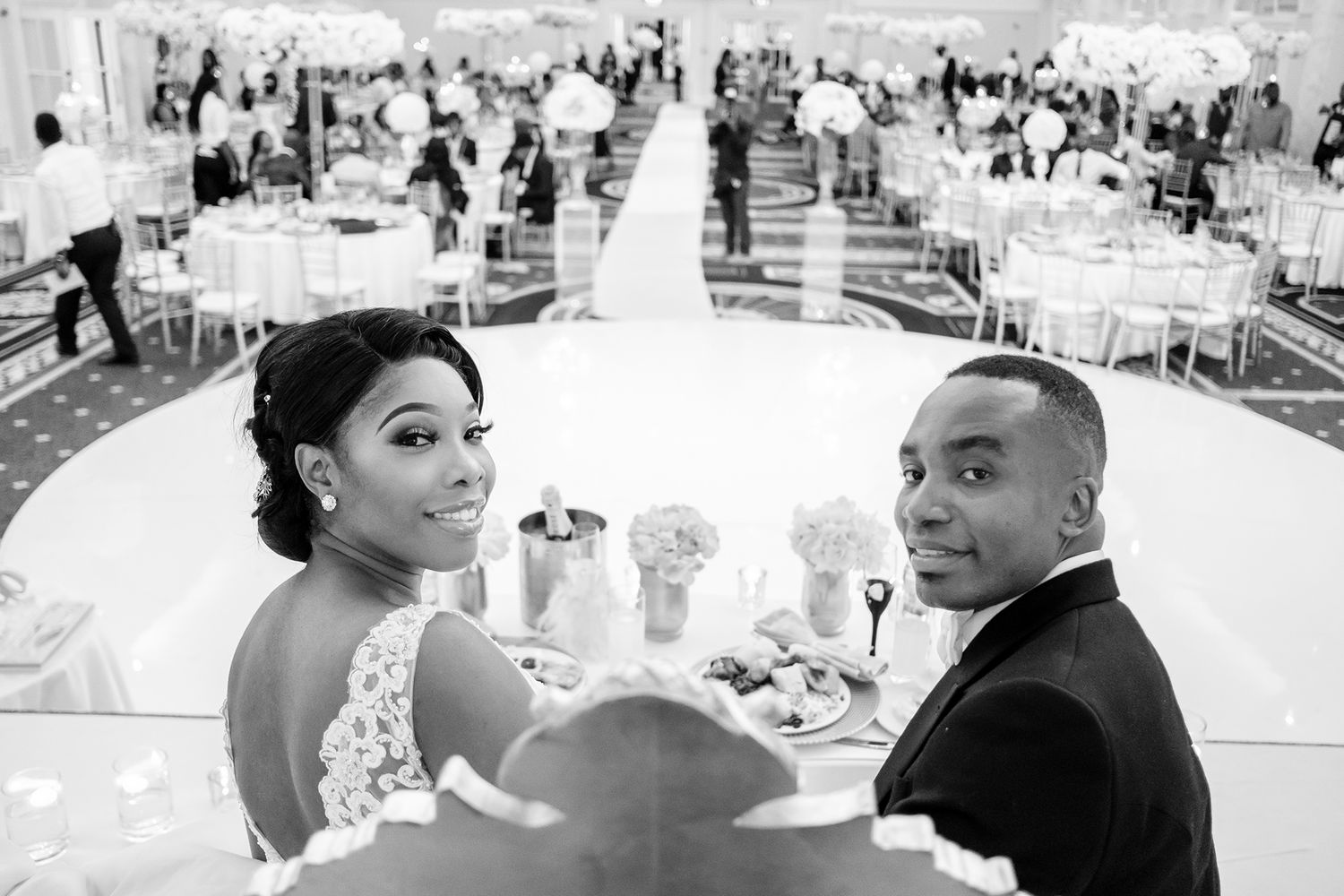 Wedding reception candid moments captured in black and white photography.