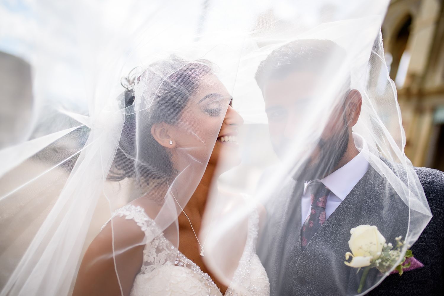 Romantic veil shots capturing intimate wedding moments with delicate lighting.