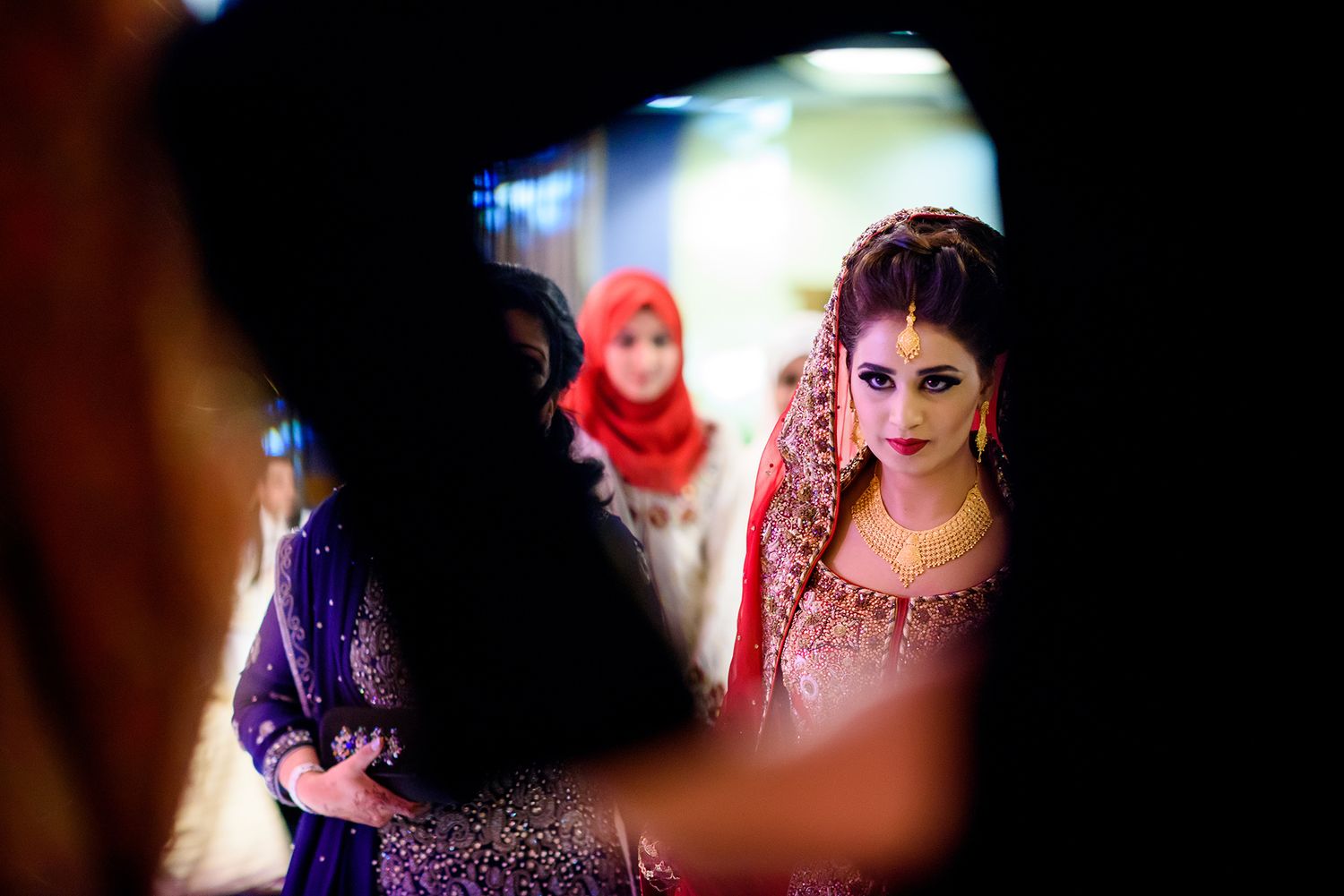 Dark artistic wedding photography with dramatic lighting effects and silhouettes.